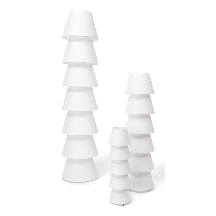 Stacked white lamps in varying heights, featuring smooth surfaces and a modern, minimalist design.