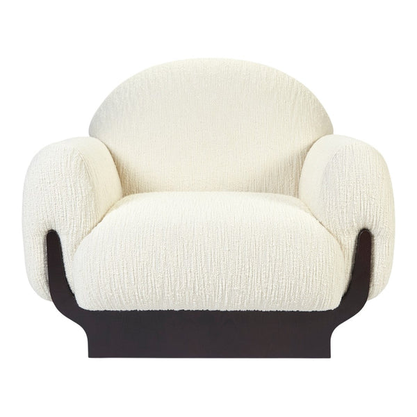 Cream textured upholstery on a rounded armchair with a sleek black base. Perfect for modern decor.