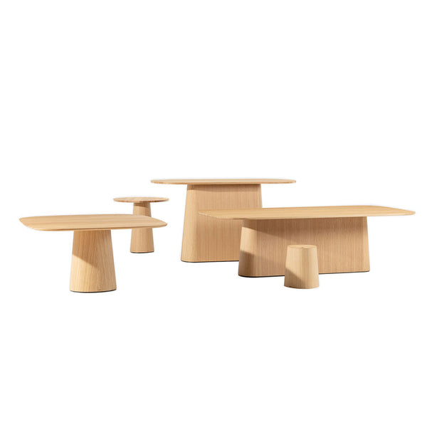 Set of three light wood tables showcasing minimalistic design and smooth, natural grain patterns.