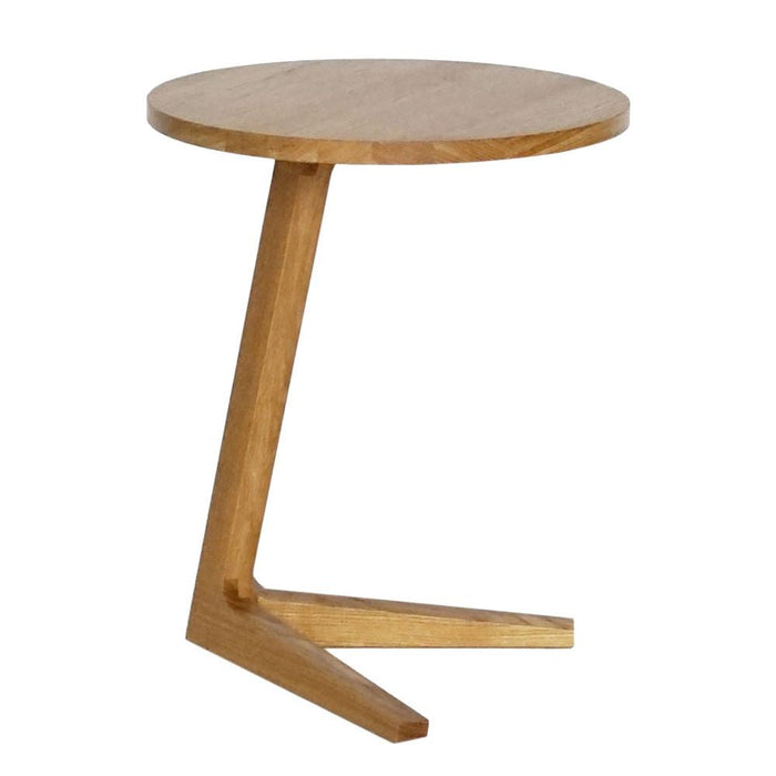 Light oak round side table with a minimalist design and natural wood finish, featuring a unique zigzag base.