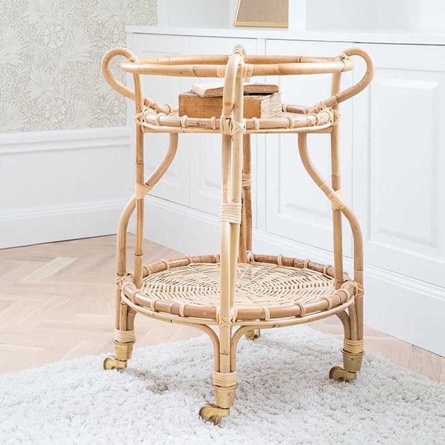 Natural rattan serving cart featuring a light beige color and woven pattern, perfect for stylish home decor.