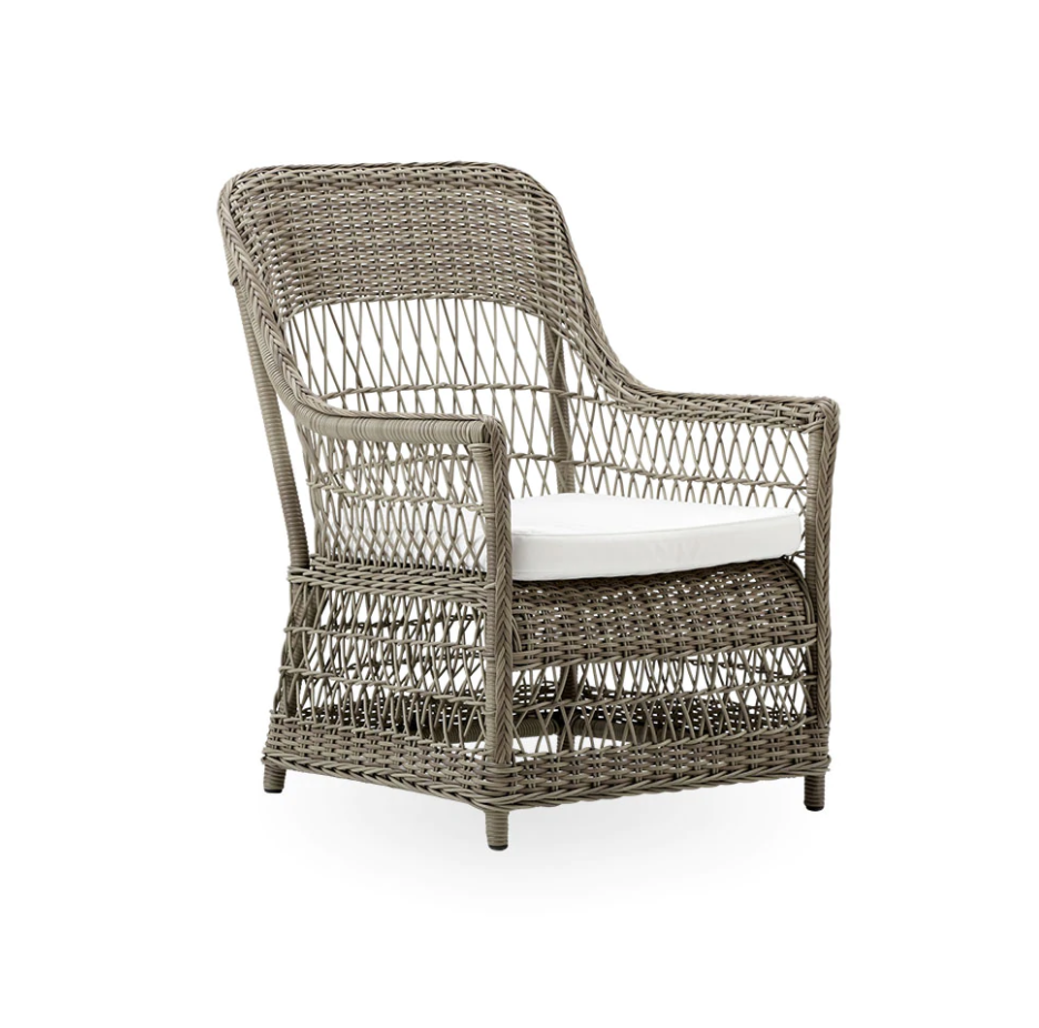 Gray woven rattan chair with a white cushion, featuring an open-strand pattern for a modern, airy look.