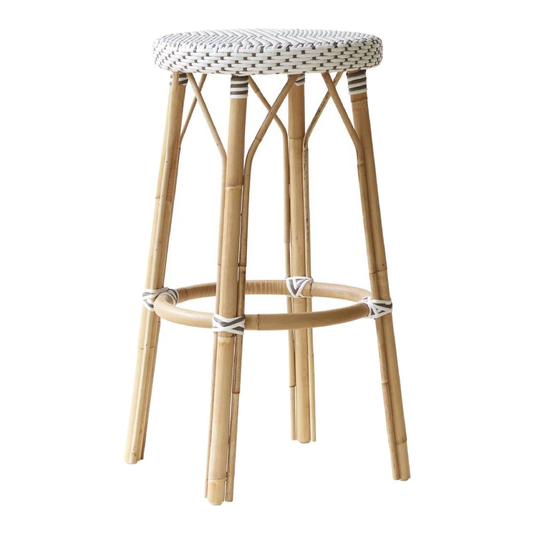 Woven white seat with black dotted pattern on a natural bamboo stool, showcasing minimalist, earthy tones.