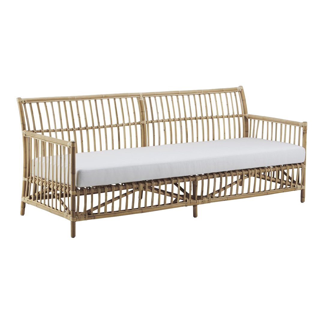 Natural rattan sofa with a white cushion. Features a sleek, minimalist design and open pattern for a modern look.