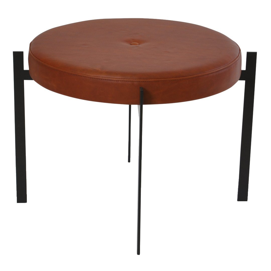 "Round brown leather stool with button detail and sleek black metal legs."