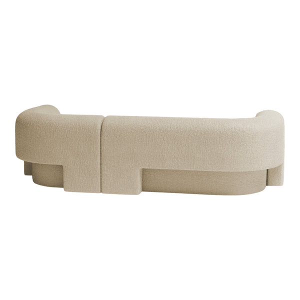 Beige curved sofa with subtle textured fabric and minimalist design. Ideal for modern living spaces.