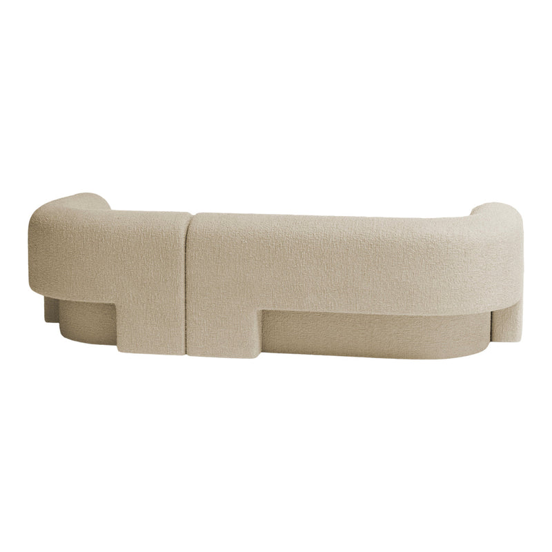 Beige curved sofa with subtle textured fabric and minimalist design. Ideal for modern living spaces.