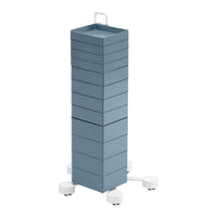 Tall, vertical storage tower in soft blue with a sleek, minimalist design and white rolling base. Perfect for organization.
