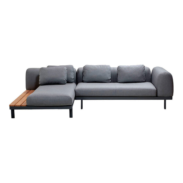 Gray sectional sofa with plush cushions and a natural wood accent, featuring a modern, minimalist design.