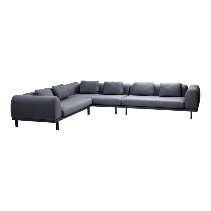 Gray sectional sofa with a smooth fabric finish and clean lines, featuring plush cushions for comfort.