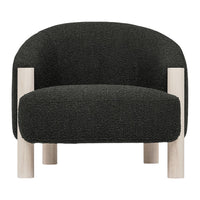 Textured black armchair with light wooden legs, featuring a modern, minimalist design. Perfect for contemporary decor.