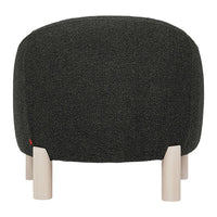 Round ottoman in textured dark green fabric with natural wood legs, featuring a minimalist design.