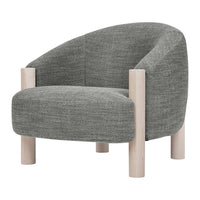 Modern curved armchair in textured grey fabric with light wooden legs. Ideal for contemporary decor.