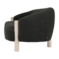 Cozy dark gray upholstered chair with a textured fabric and light wooden legs, featuring a subtle red accent.