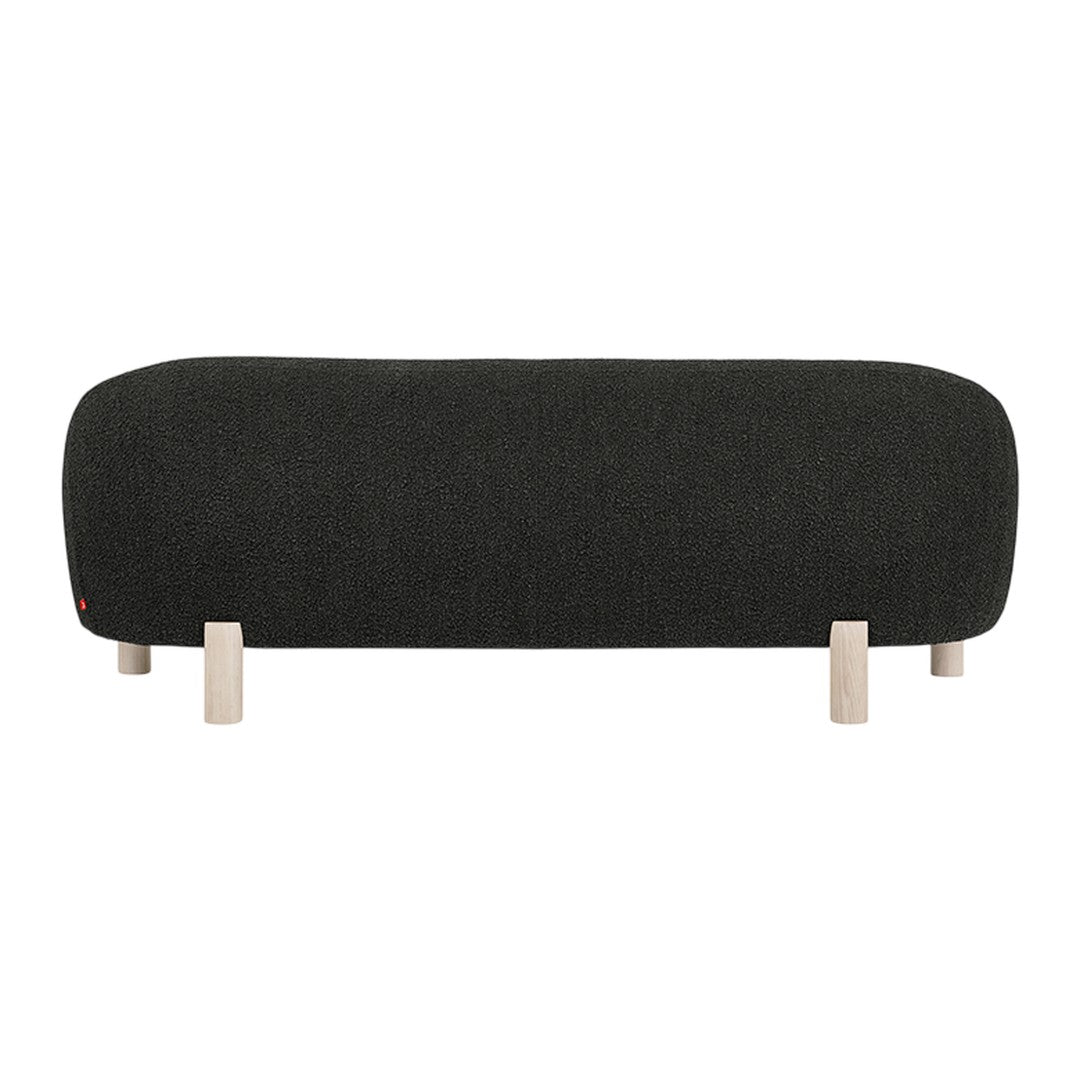 Dark gray upholstered bench with a smooth, rounded design and light wooden legs for a modern touch.