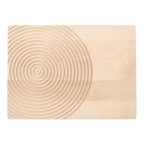 Natural wood cutting board with a smooth surface and concentric circle pattern in a light beige hue.