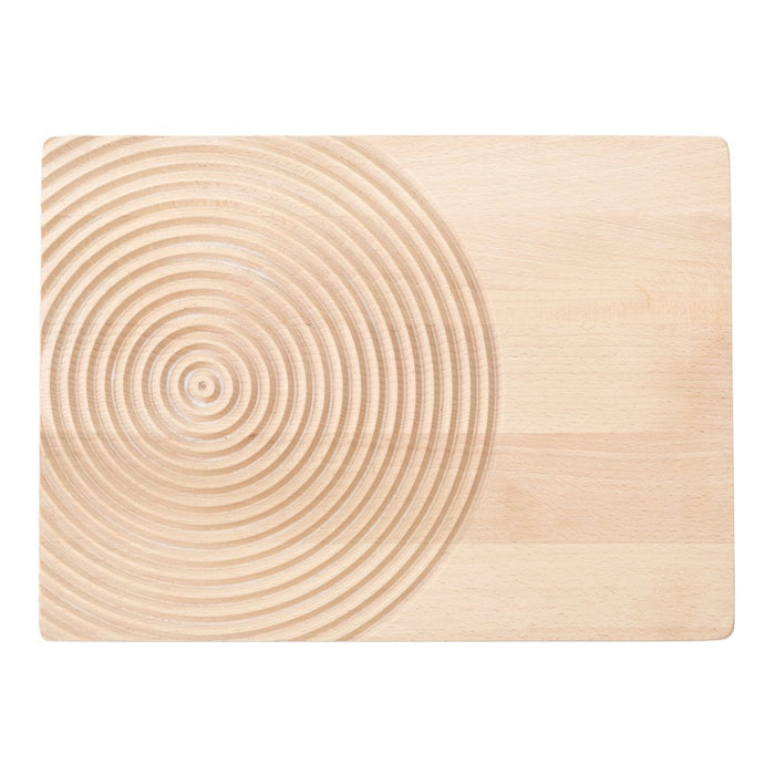 Natural wood cutting board with a smooth surface and concentric circle pattern in a light beige hue.