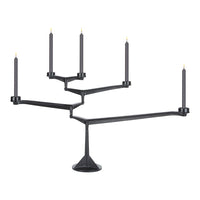 Black candle holder with five taper candle slots and sleek, modern geometric design.