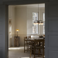 Cozy interior featuring natural wood tones, soft white walls, and warm lighting accents, creating a serene atmosphere.