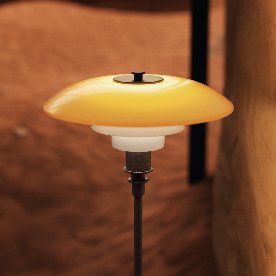 Yellow and white modern lamp with a sleek design, featuring a rounded shade and minimalist base. Perfect for stylish decor.