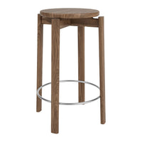 Wooden bar stool with a round, natural wood top and sleek, metallic footrest. Simple, modern design in warm brown tones.