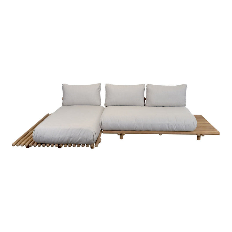 White cushions on a natural bamboo frame, featuring a minimalist design and a soft, neutral palette.