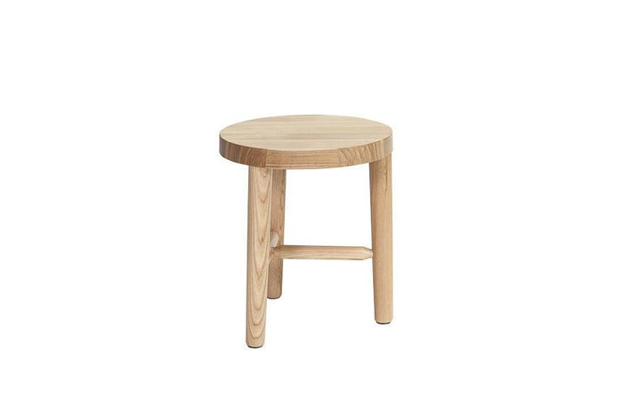 Light natural wood stool with a smooth, circular top and simple, clean lines. Perfect for minimalist decor.