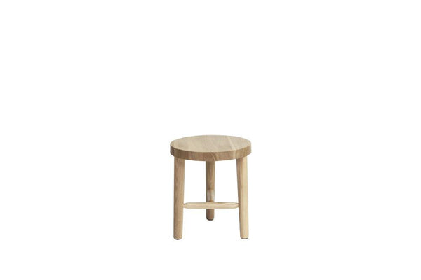 Light wood circular stool with natural grain pattern and three sturdy legs, perfect for minimalist decor.