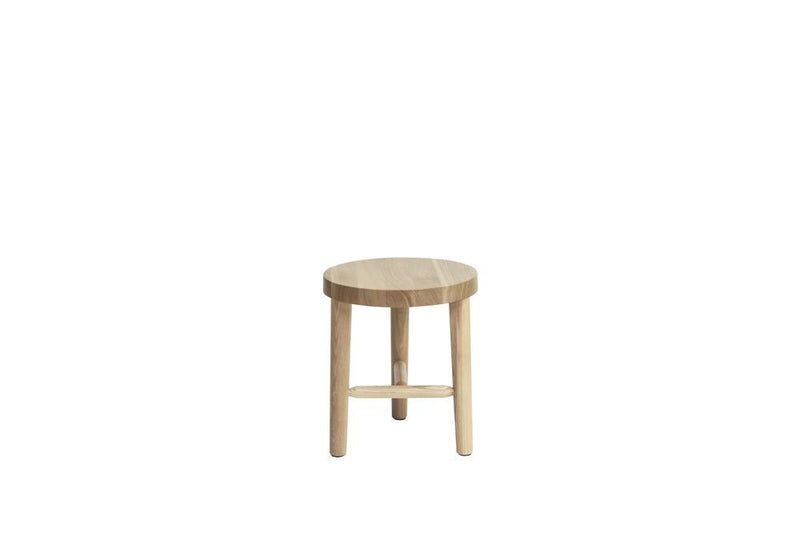 Light wood circular stool with natural grain pattern and three sturdy legs, perfect for minimalist decor.