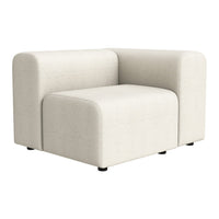 Soft beige upholstered corner chair with clean lines and minimalistic design, perfect for modern decor.