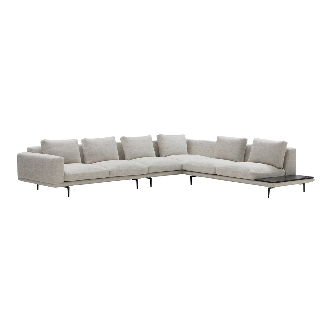 Light gray sectional sofa with a minimalist design and subtle texture, featuring plush cushions and sleek metal legs.