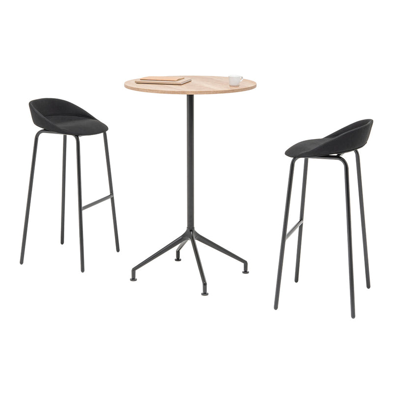 Stylish black bar stools paired with a natural wood and black table, creating a modern minimalist look.