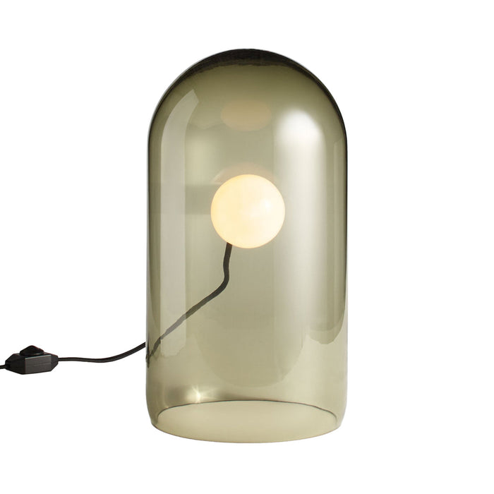 Smoky green glass lamp with a round white bulb, featuring a minimalist design and sleek silhouette.