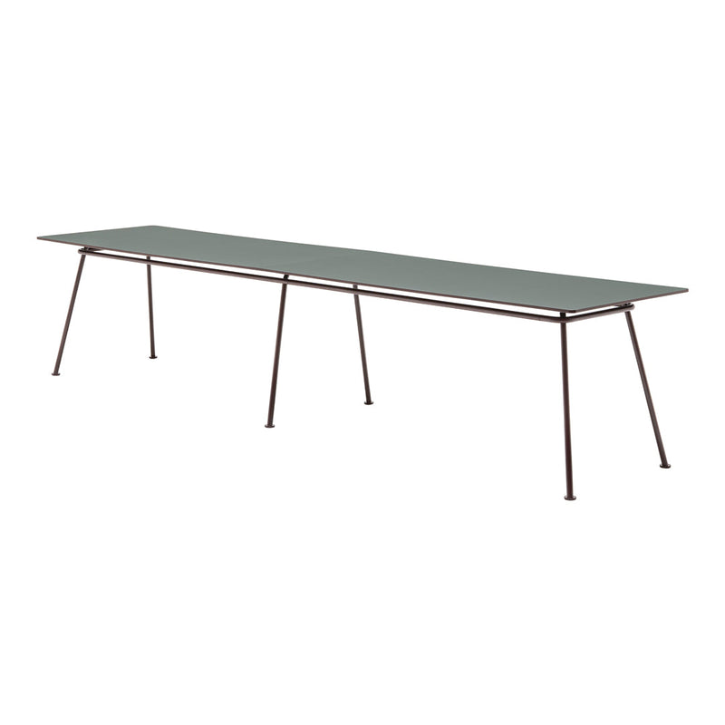 Long rectangular tabletop in muted green with sleek metal legs, featuring a minimalist design and no visible patterns.