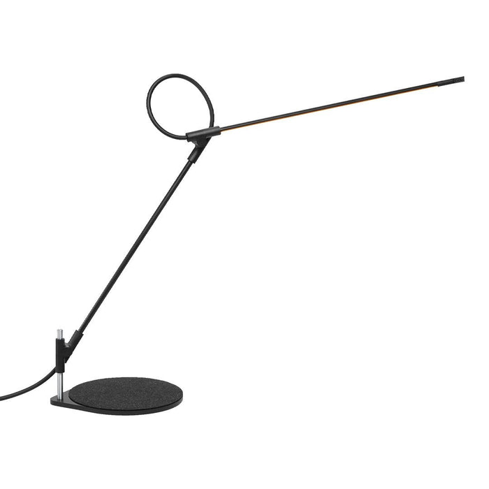 Sleek black lamp with a circular accent and a slim, linear light source on a round base, perfect for modern decor.