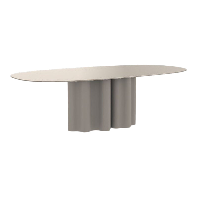 Oval table in soft beige with a rounded, sculptural base and seamless finish. Modern, minimalist design.