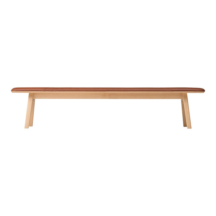 Natural wood bench with a light beige finish and a rich brown cushioned top. Sleek, minimalist design.