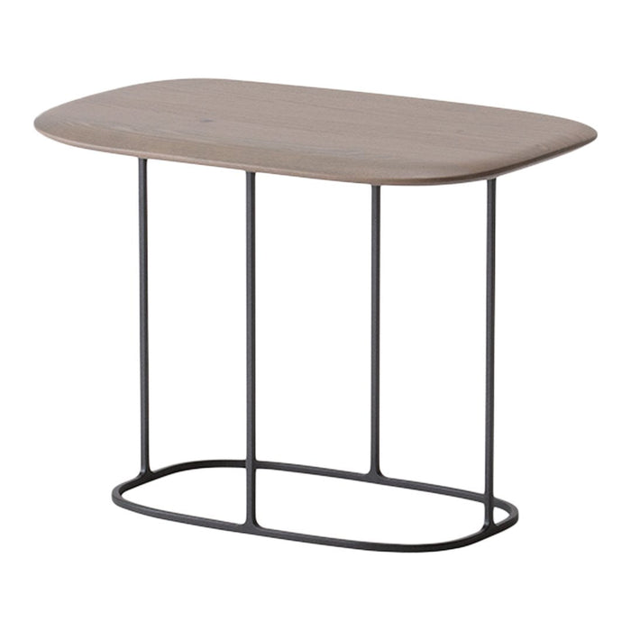 Light wood tabletop with rounded edges and thin black metal legs, showcasing a minimalist, modern design.