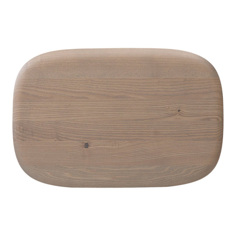 Light brown wooden cutting board with a smooth, rounded rectangular shape and natural grain patterns.