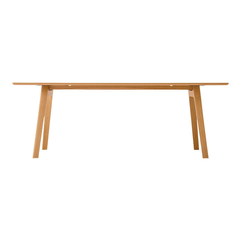 Natural wood dining table in a light oak finish, featuring clean lines and a minimalist design.