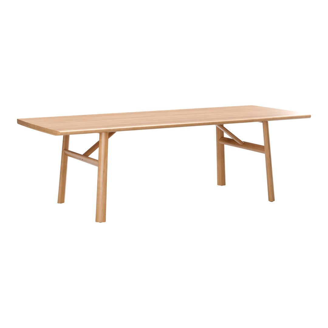 Natural wood dining table with a light oak finish and simple, modern design featuring clean lines and no patterns.