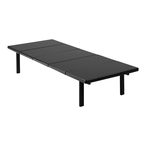 Sleek black rectangular table with a smooth surface and minimalist design, perfect for modern spaces.