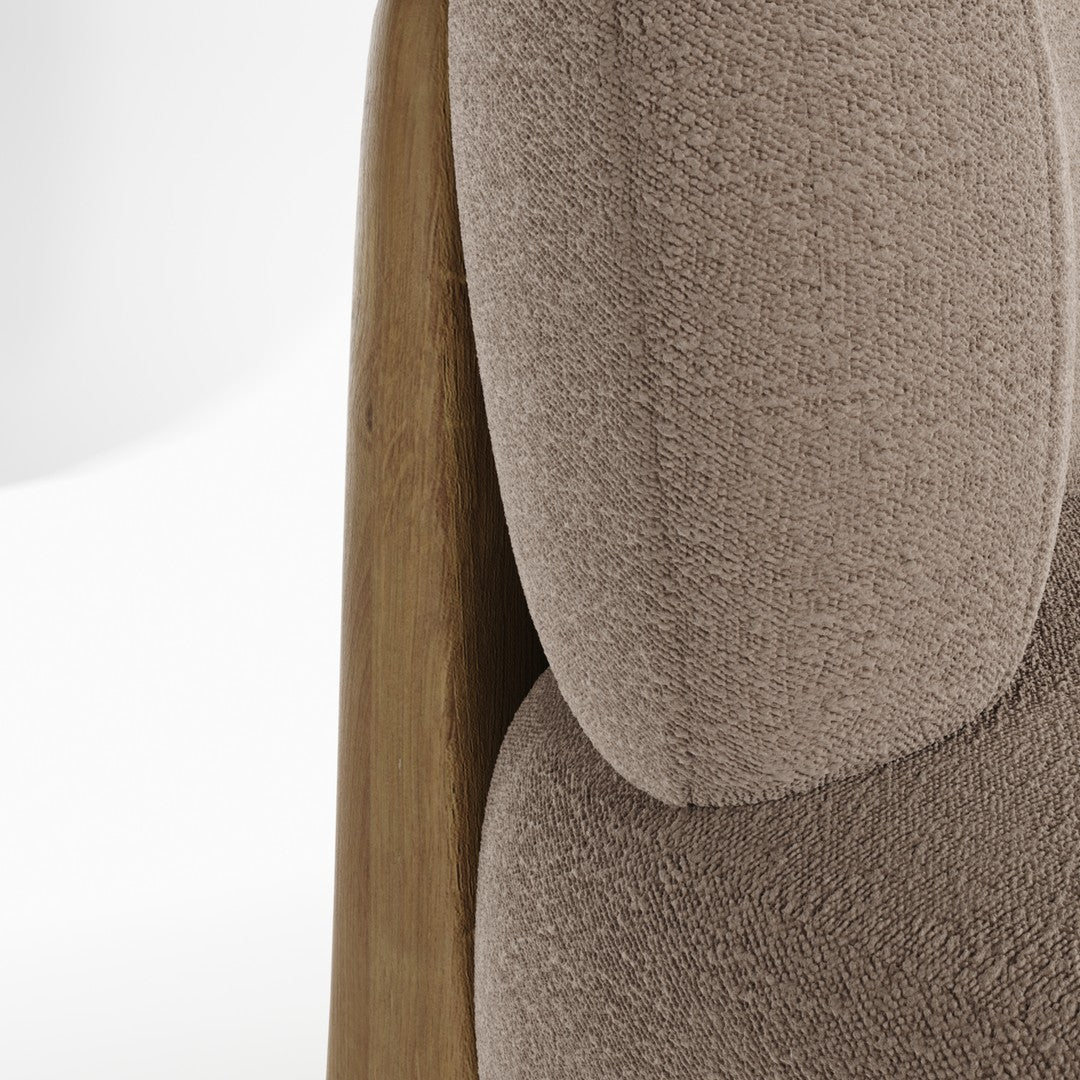 Textured taupe upholstery on a curved chair with natural wood accents, showcasing a modern, minimalist design.