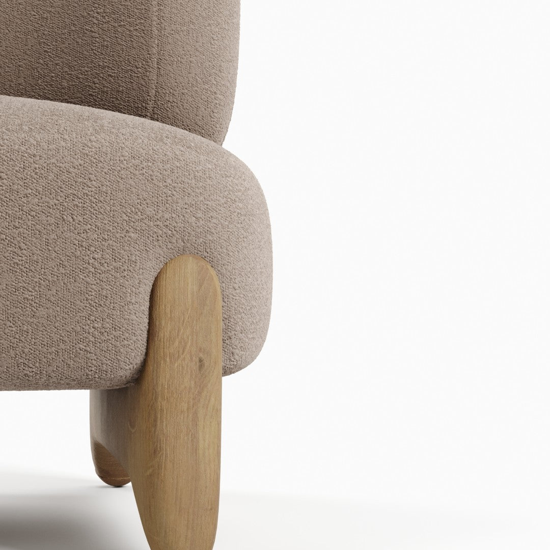 Soft taupe upholstery with subtle texture and light wood legs, perfect for modern living spaces.
