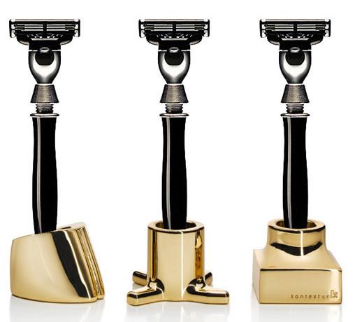 Stylish razors with sleek black handles and metallic gold bases, featuring a polished finish and modern design.