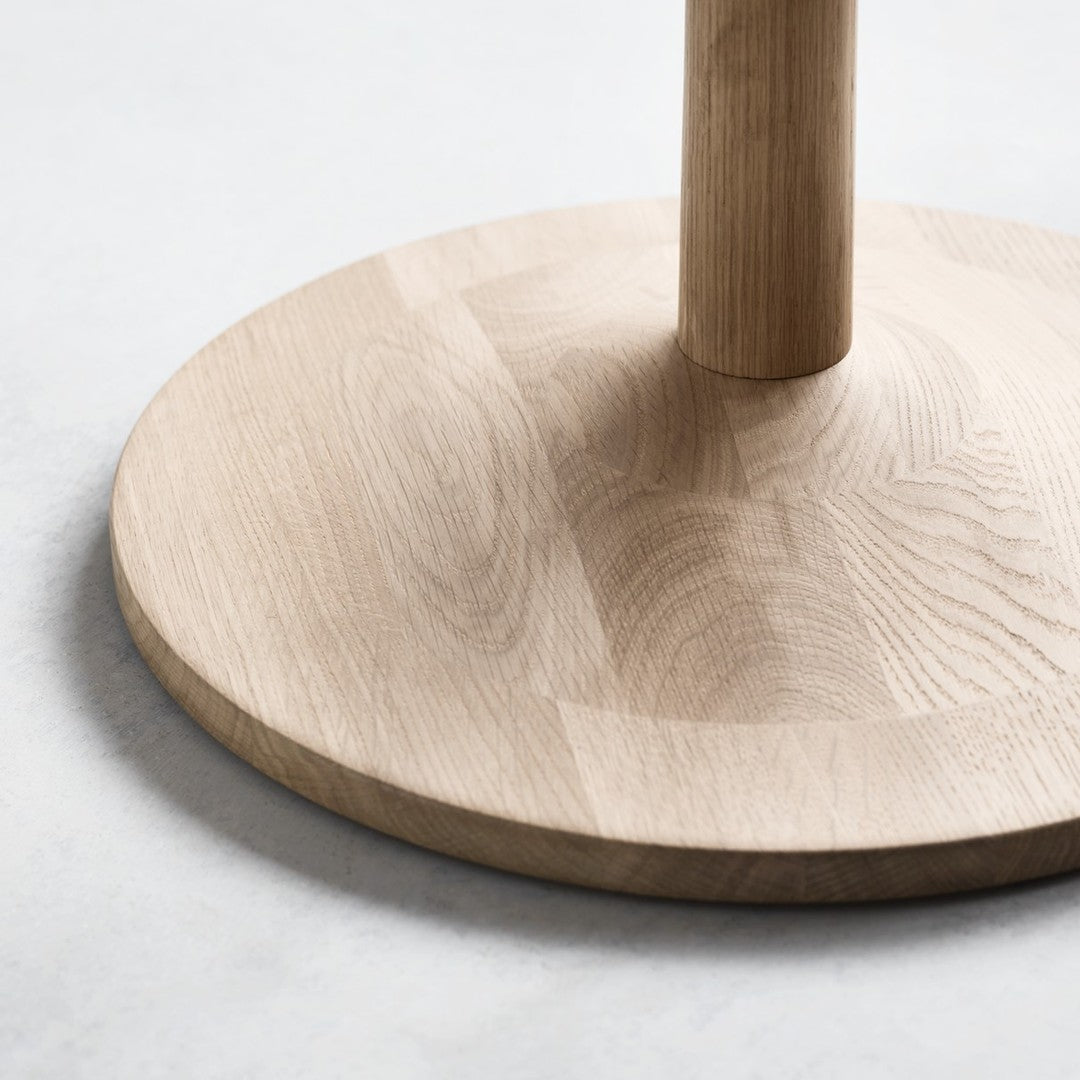 Natural wood base with a light oak finish, featuring a smooth, matte texture and subtle grain patterns.