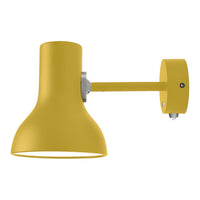 Bright yellow wall lamp with a smooth finish and modern design, featuring a simple, sleek silhouette.