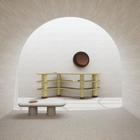 Modern furniture in soft gray and muted yellow with smooth textures, complemented by a brown circular accent.