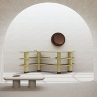 Modern furniture with soft yellow and beige tones, featuring smooth curves and minimalist design.