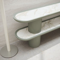 Green and white marble-patterned shelf with a modern design, featuring smooth curves and clean lines.